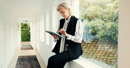 Mature woman, reading and tablet at house for research, email client and selling property. Female...