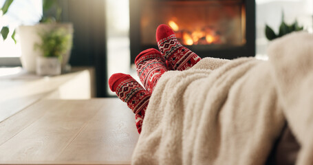 Christmas, cozy socks and feet of people in home for vacation break, festive season and bonding....