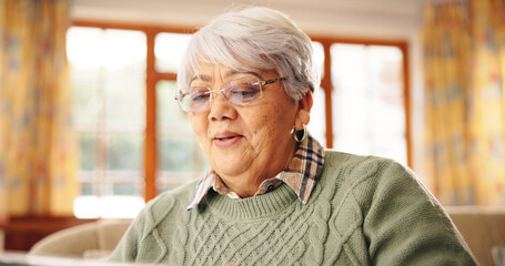Old woman, tablet and relax on couch with smile for movie, streaming and subscription in lounge at...