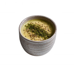 Delicious bowl of creamy soup garnished with herbs, presented in a rustic ceramic cup, perfect for culinary and food photography.