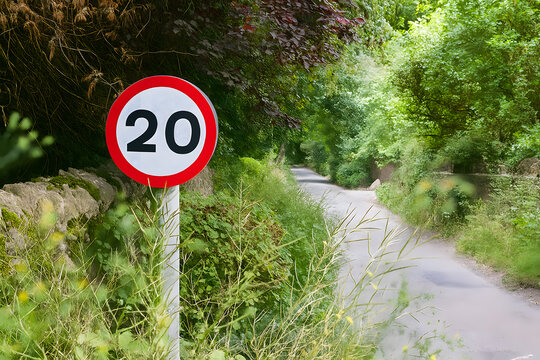 20 mph speed limit sign posted on country road for safety, transportation, and traffic visuals