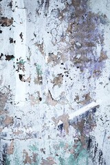 Weathered urban wall texture with rustic vintage look in faded whites, greys, purples. 90s, grunge...