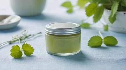Homemade Herbal Balm in Metal Tin on Light Blue Fabric