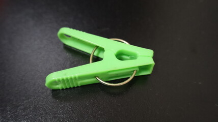  Plastic clothespin on a black background