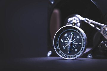 Searching for information on HDD. Compass and computer hard drive. Search for cryptocurrency....