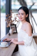 Asian freelance people business female talking making using casual working with laptop computer and...