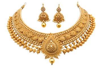 A meticulously detailed, ornate gold necklace and matching earrings are displayed against a stark white background
