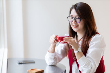 Close-up beautiful happy Smiling of hands Holding cup mug of Hot coffee latte wits business female...