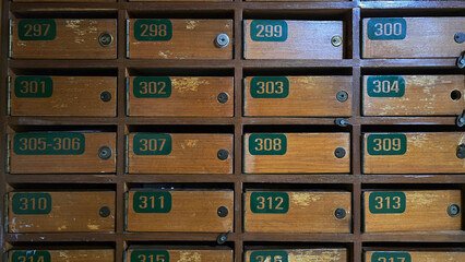 Vintage wooden mailbox lockers with numbered drawers