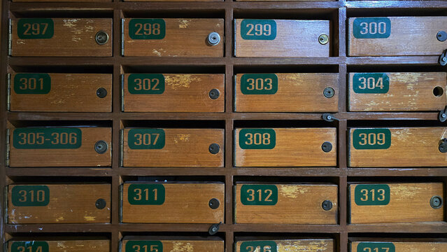 Vintage wooden mailbox lockers with numbered drawers - Powered by Adobe