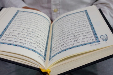 Southeast Asian Muslim Man Reading Holy Book: An Islamic Perspective of Spiritual Guidance and Ancient Text