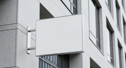 A blank rectangular signboard on a modern building, an outdoor advertising mockup, for business branding displays, commercial signage templates, and urban architecture elements.