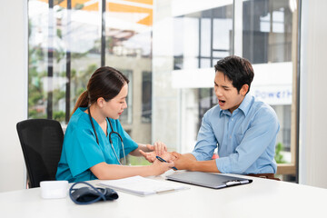 Physiotherapist, doctor and patient man with Carpal Tunnel Syndrome hand Wrist  pain for...