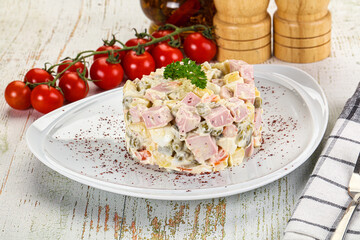 Russian traditional Olivier salad with sausages