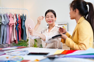 Young Asian woman doing personal color diagnosis for determining skin undertone and seasonal color...