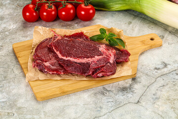 Raw beef cheeks cut for cooking