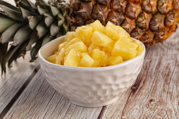 Sweet canned pineapple fruit pieces