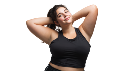Confident woman with long hair poses with hands behind head, wearing a black sports top, on white isolated background.