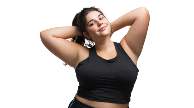 Confident woman with long hair poses with hands behind head, wearing a black sports top, on white isolated background. - Powered by Adobe