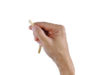 Close-up of a person using siwak, an organic toothbrush from Islamic tradition, ideal for dental care visuals