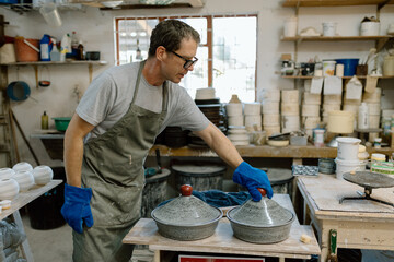 Artist in Ceramics and Pottery Studio working