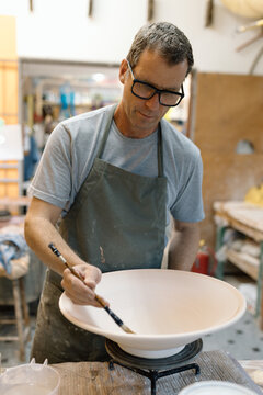 Artist in Ceramics and Pottery Studio working