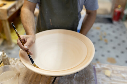 Artist in Ceramics and Pottery Studio working
