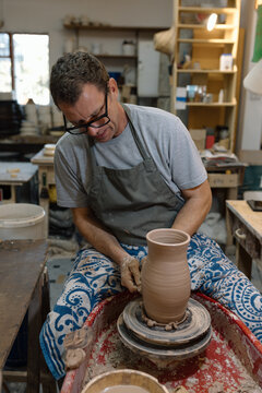 Artist in Ceramics and Pottery Studio working