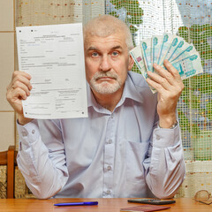 Russia, Samara. 28. 01 2017. A man fills out a tax return. Text in Russian: passport of the Russian...