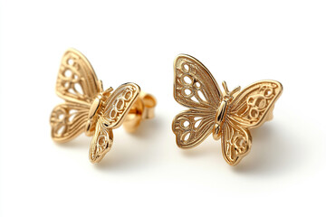 Fototapeta premium Elegant butterfly earrings showcasing intricate gold details, perfect for adding a touch of nature-inspired beauty to any jewelry collection.