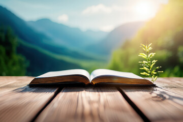 Open book rests wooden table, surrounded by serene landscape of mountains and greenery, symbolizing knowledge and nature