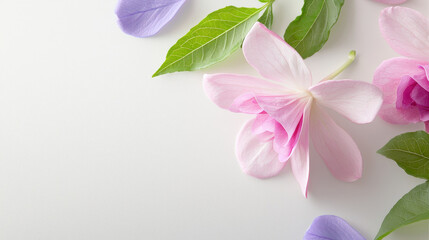 Watercolor fuchsias in soft pinks and purples create serene floral arrangement with lush green leaves