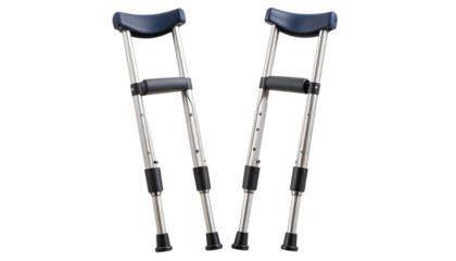 Adjustable metal crutches with padded underarm rests, hand grips, and rubber tips. Isolated with a cut-out transparent background.