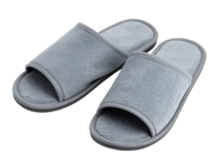 Cozy pair of grey plush slippers isolated on transparent background