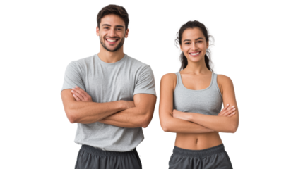 Smiling couple posing confidently with arms crossed, showcasing a healthy and active lifestyle.