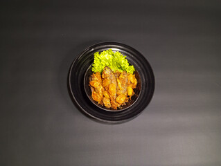 Overhead View of Spicy Fish Dish with Lettuce and Starfruit Seasoning