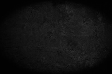 Art black concrete stone texture for background in black. Abstract color dry scratched surface wall...