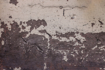 Close Up Of Damaged peeling Wall With Contrasting Light And Dark Textured Areas Indicating Decay