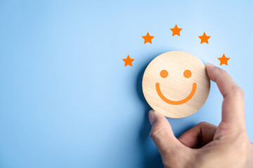 Happy smile face and satisfaction rating with five star feedback customer experience, positive...