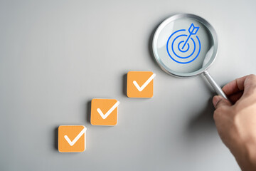 Planning checklist goal target in magnifying glass, project planning, strategic objectives, task...