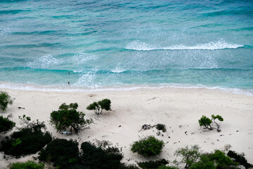 Beautiful view of Cristo Rei Backside Beach or known as Dolok Oan Beach in Dili, Timor Leste. Aerial view of tropical beach.