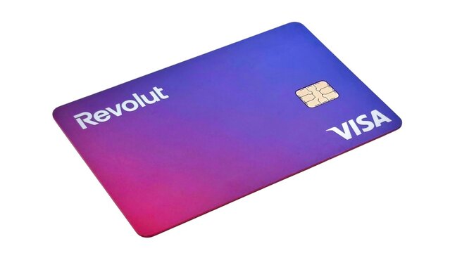 Photo of a Revolut card on a white background. This multi-currency debit card pairs with the Revolut app, combining modern fintech with traditional banking features.