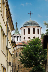 View of the Church of Saints Constantine and Helena from a narrow street in the medieval town of Veliko Tarnovo in Bulgaria. The concept of tourism and travel