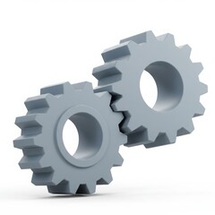 Two interlocking grey gears on white background machinery 1