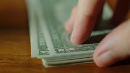 counting of dollars close up - Powered by Adobe