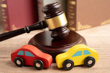 Car accident lawsuit and insurance, Judge hammer with car model.