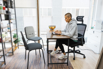 Female nutritionist working on laptop in modern office