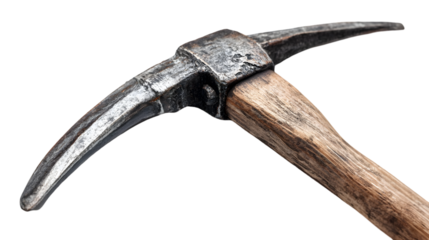Close up view of a weathered pickaxe with a wooden handle against a dark background in sharp focus