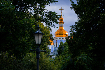 church dome architectural landmark object religious building in park foliage foreground frame work