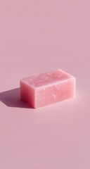 Pink bar of soap on a pink background